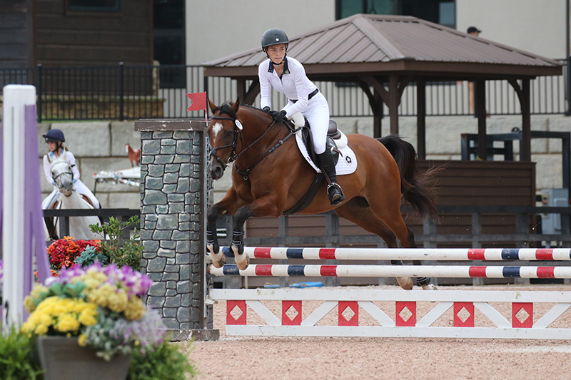 Marissa jumping. Photo courtesy of Marissa Redmond