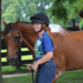 Smiling girl with her horse