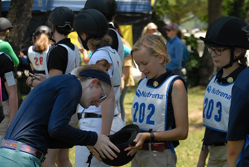 Inspecting a helmet for the appropriate certifications. 