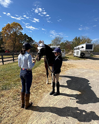 A girl and her horse awaiting inspection.