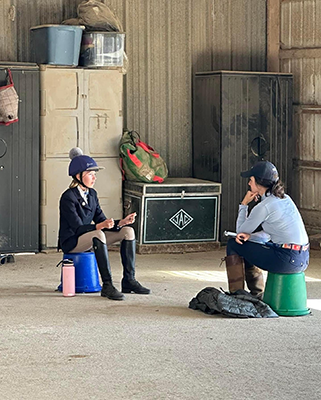 Two girls in frame, practicing