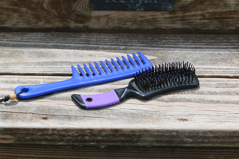 A wide tooth comb and brush.