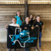 A group of young girls holding a banner with the name of their Pony Club on it.