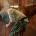 Farrier putting on a hot shoe