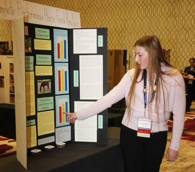 girl presenting project poster