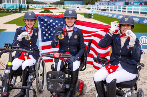 Three paralympic dressage athletes on the medal podium.