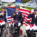 Three paralympic dressage athletes on the medal podium.