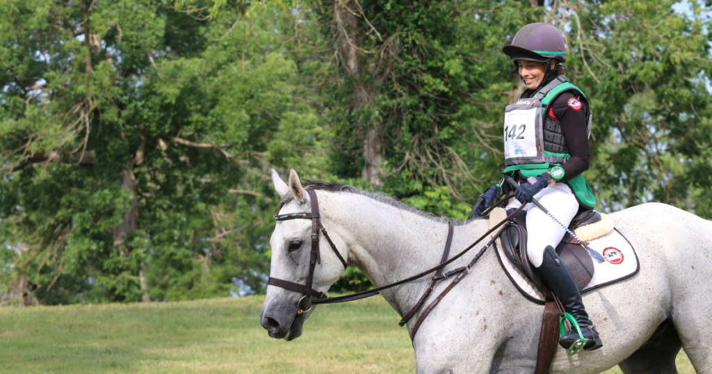 horseback rider wearing safety vest