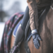 A rider patting their horse