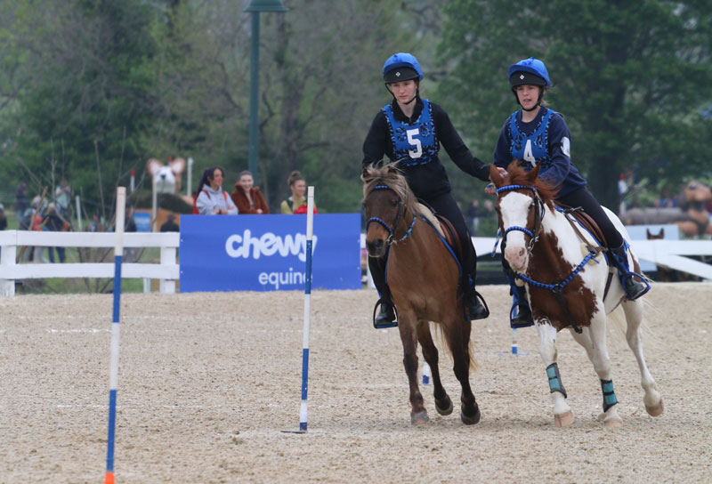 Stella Rosen on Izzy (left) and McKayla Kelly on YoYo (right) from the team Full Throttle on the run during the 2025 Chewy Mounted Games Invitational. Elizabeth Moyer/United States Pony Clubs