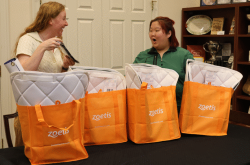 Loralye Page (left) and Sage Argent (right) work on swag bags for the USPC team for the 2025 USEF Pony Jumper Championships at USEF Pony Finals. Elizabeth Moyer/United States Pony Clubs