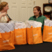Loralye Page (left) and Sage Argent (right) work on swag bags for the USPC team for the 2025 USEF Pony Jumper Championships at USEF Pony Finals. Elizabeth Moyer/United States Pony Clubs