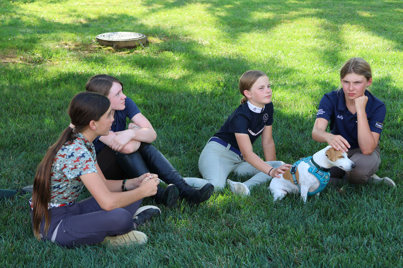 Georgia Myers, Savannah Nieman, Emma Shade Kleintop, and Molly Myers with Richard Lamb's dog. Elizabeth Moyer/United States Pony Clubs