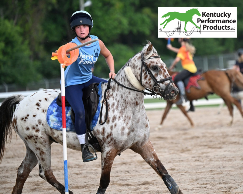 A young girl riding her pony, smiling.